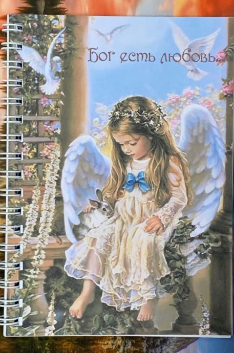 Блокнот А6 (10,5*15 см), 40 листов на пружине "Бог есть любовь" ребенок-ангел, блок в клетку с местами из библии